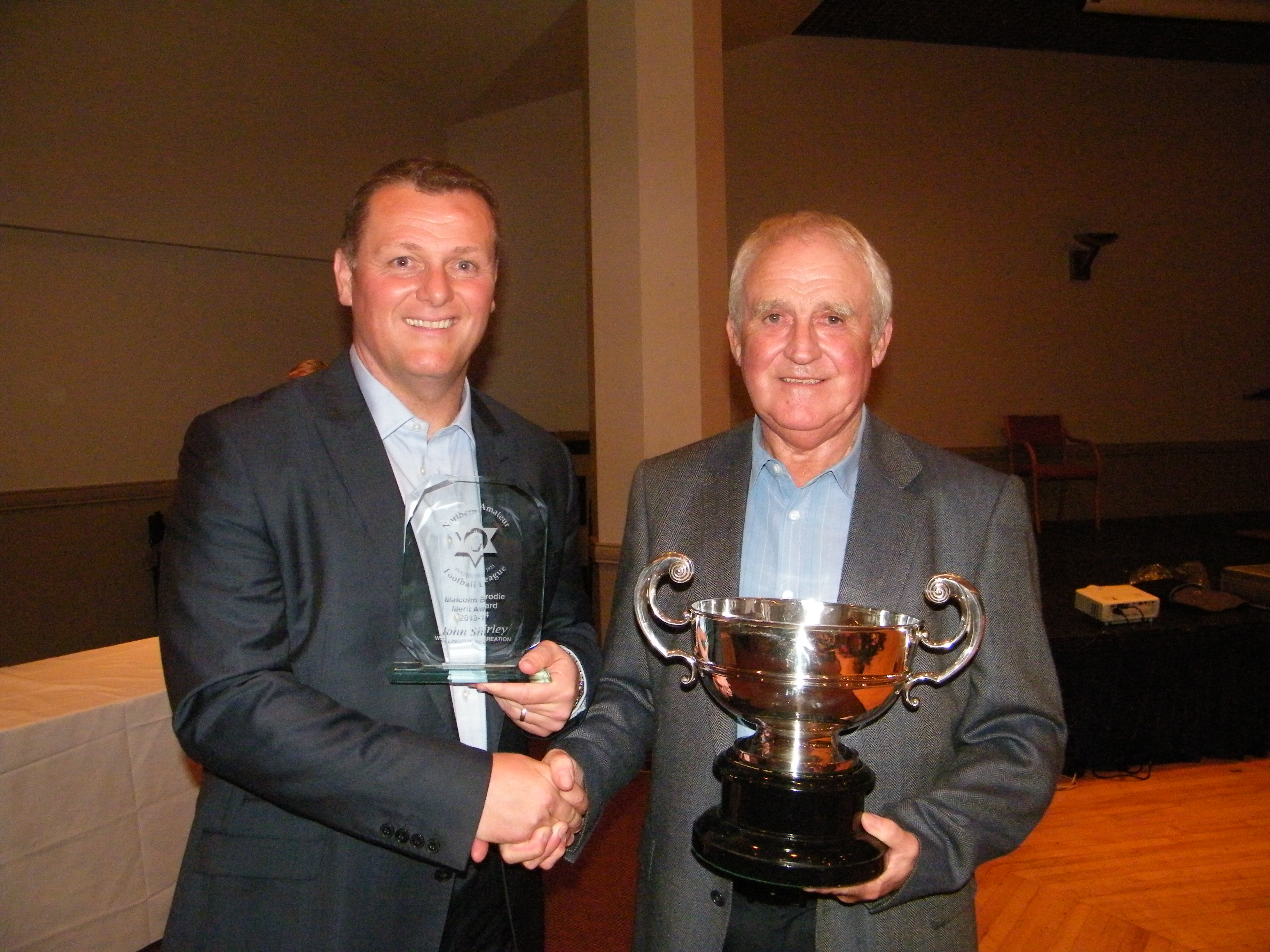 John Shirley (Wellington Rec) receives the Malcolm Brodie merit award from Jim Magilton
